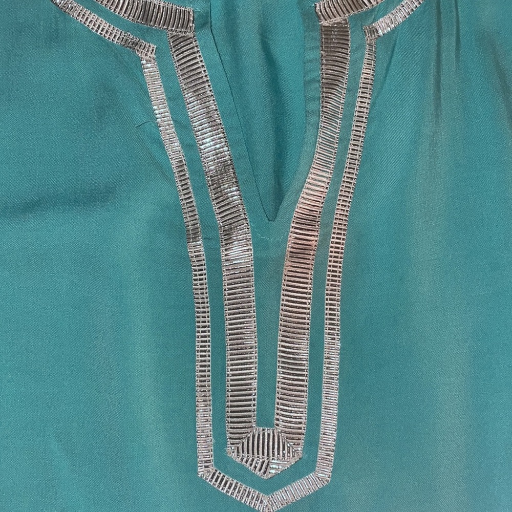 Turquoise tunic with silver piping split-open front